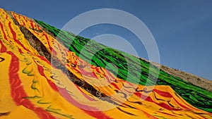 Colorful fabric drying after traditional dye process