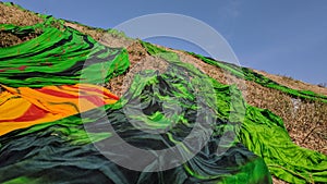 Colorful fabric drying after traditional dye process