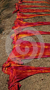 Colorful fabric drying after traditional dye process