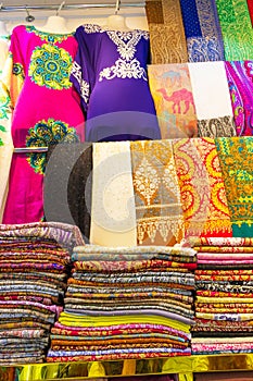 Colorful fabrics on display at Dubai Old Souk shop UAE