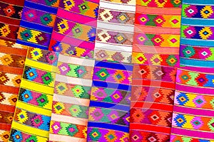 Colorful fabrics on market in Chichicastenango photo