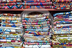 Colorful fabrics on sale in a shop Muttrah Souk, in Muttrah, Muscat, Oman, Middle East