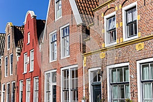 Colorful facades of brick houses in Harlingen