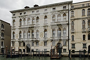 Colorful facades of old medieval and historical houses along Grand Canal in Venice, Italy. Venice is situated across a group of 11