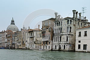 Colorful facades of old medieval and historical houses along Grand Canal in Venice, Italy. Venice is situated across a group of 11