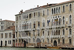 Colorful facades of old medieval and historical houses along Grand Canal in Venice, Italy. Venice is situated across a group of 11