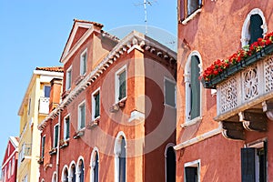 Colorful facades of old medieval houses in Venice.