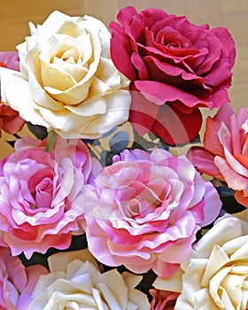 Colorful fake rose flowers top view