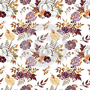 Colorful fall seamless pattern with pumpkins, flowers and leaves on white background. Fall floral print. Watercolor illustration