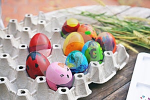Colorful fancy easter eggs in a tray