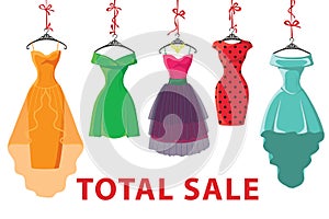 Colorful fashion colored dresses hang on ribbon.Total Sale