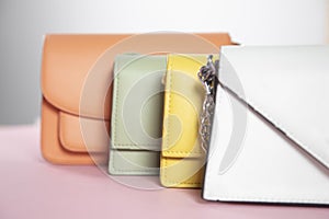 Colorful fashion handbags on table
