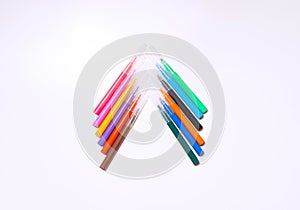 Colorful felt-tip pens on the white background. Markers and pencils pattern. Background