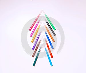 Colorful felt-tip pens on the white background. Markers and pencils pattern. Background