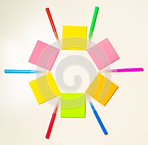 Colorful felt-tip pens on the white background. Markers and stickers pattern in the shape of star.