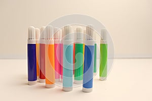 Colorful felt-tip pens on white background for school banner design