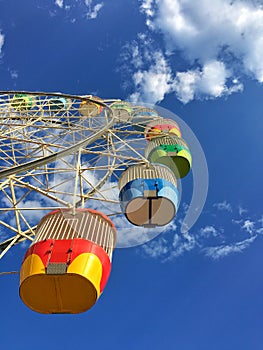 Colorful ferris wheel with a beautiful blue sky at Luna park Sydney, Australia. photo