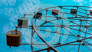 Colorful ferris wheel with blue sky background