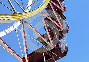 Colorful ferris wheel with blue sky background and copy space