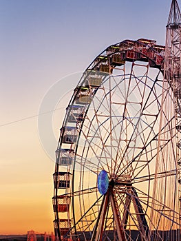 Colorful ferris whell at sunset