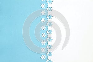 Colorful festive background with cut out snowflakes