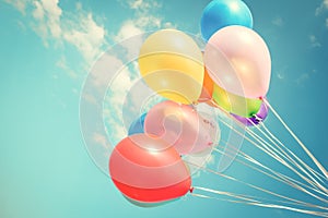 Colorful festive balloons over blue sky