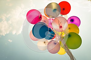 Colorful festive balloons over blue sky