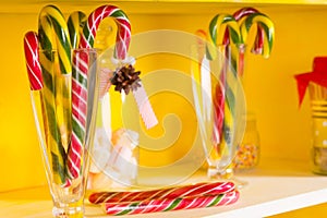 Colorful festive candy canes in glass jars