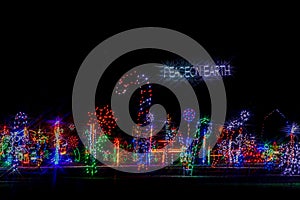 Colorful festive Holiday Christmas Light display, Peace on Earth