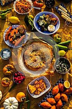 Colorful and festive image of Mediterranean food gathering with flatbread, bulgur meatballs, vegetables and appetizers