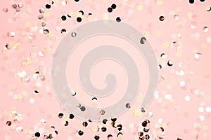 Colorful festive round confetti dots on pink background. Holiday greeting card