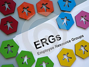Colorful figurines and papers about Employee Resource Groups ERGs.