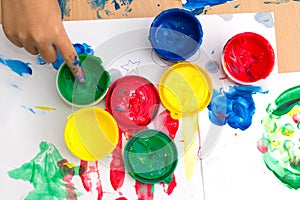 colorful finger paints on a table