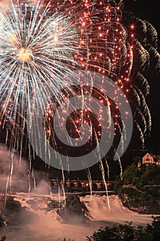 Colorful firework over the Rhine Falls to celebrate traditionally the Swiss National Day