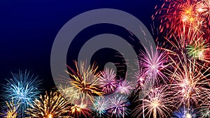 Colorful fireworks display on dark blue