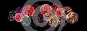 Colorful fireworks pattern black night sky background isolated closeup, firecracker border, red, golden, purple sparks backdrop