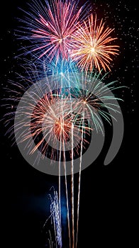 Colorful fireworks soaring over a black background. Can be used as abstract background or wallpaper