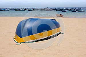 Colorful fisher boats in blue turquoise sea on the beach