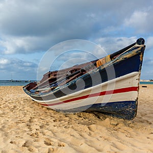 Colorful fisherman boat on beach