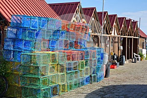 Colorful fishing baskets covos and fisherman`s huts in the fishing harbor of Santa Luzia, located near Tavira, Algarve