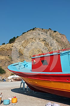 Colorful fishing boat on dry land