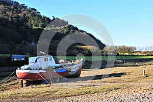 Colorful fishing boat moored at Porlock Weir,