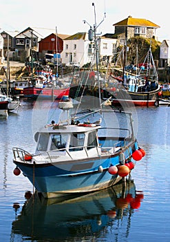 Colorful fishing boats at anchor in harbor