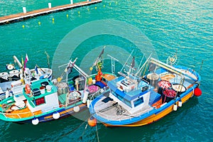 Colorful fishing boats on the pier in Amalfi coast, Italy. Mediterranean sea coast