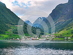 Colorful fishing village and mountain landscape of Sognefjord. N