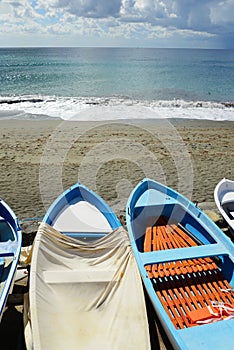 Colorful fishing wooden boat moored on the beach