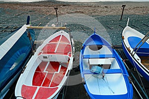 Colorful fishing wooden boat moored on the beach