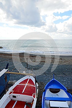 Colorful fishing wooden boat moored on the beach