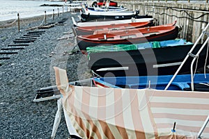 Colorful fishing wooden boat moored on the beach