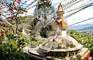 Colorful flags flutter in the wind over the ancient stupa in Kathmandu, Nepal